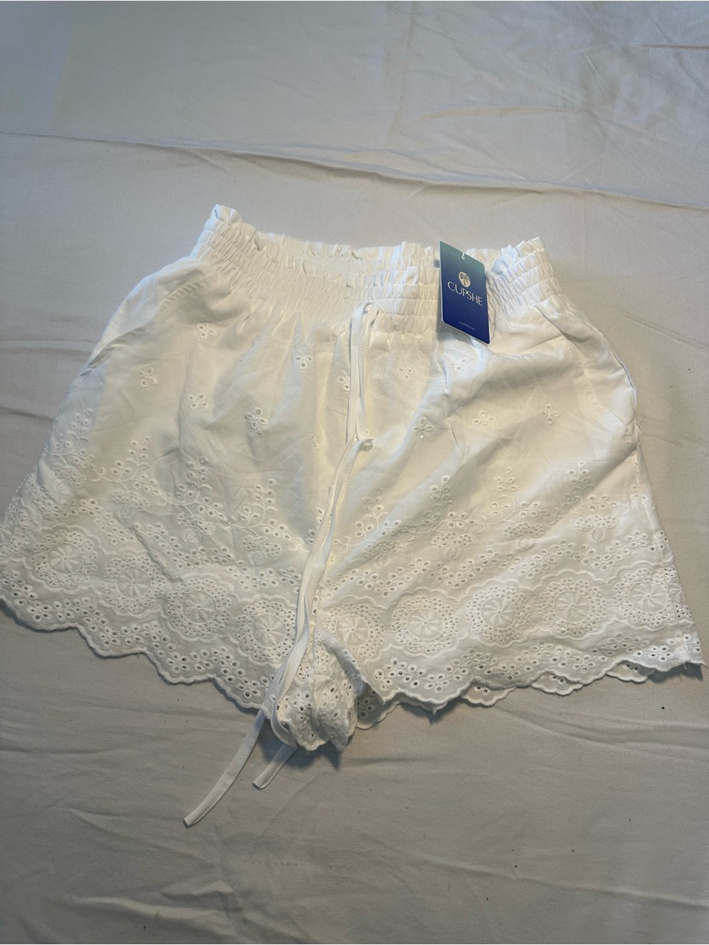Cupshe White Eyelet Drawstring Scalloped Shorts